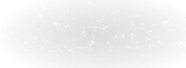 Stock photo of glittering stardust particles sparkling in a dark, cosmic background.