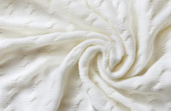 Crumpled white knitted blanket — Stock Photo, Image