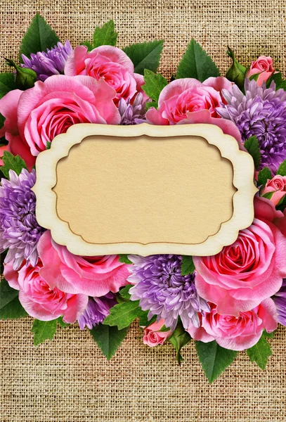 Rose and chrysanthemum flowers with card on canvas — Stock Photo, Image