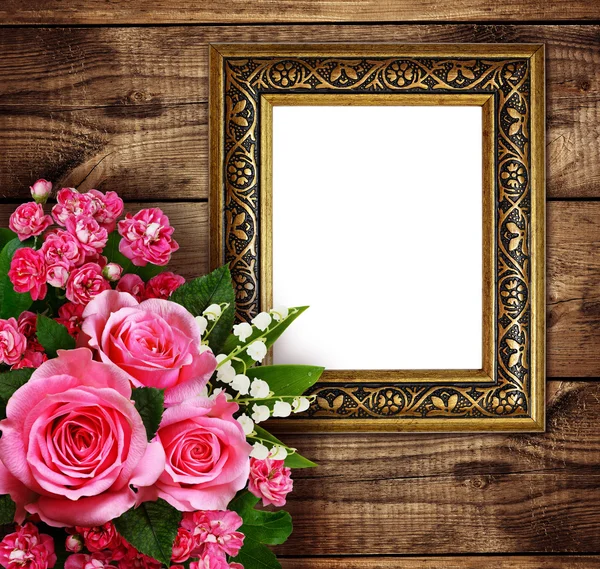 Pink flowers arrangement and a frame — Stock Photo, Image