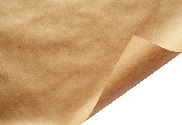 Sheet of craft paper with curled corner — Stock Photo, Image