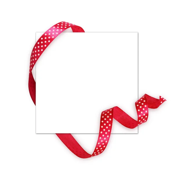 Pink silk polka dot ribbon and a card — Stock Photo, Image