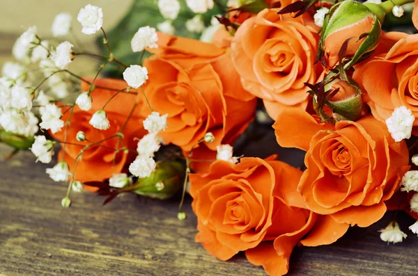 Roses on wooden background — Stock Photo, Image