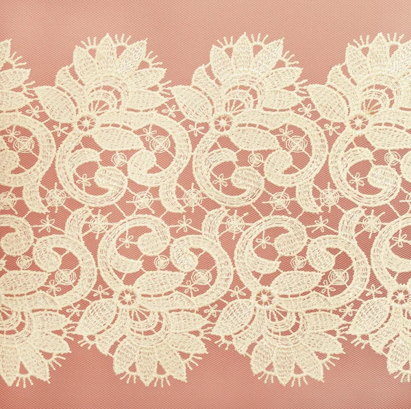 White lace on pink background — Stock Photo, Image