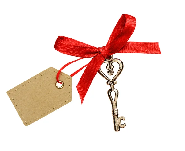 Czerwoną wstążką, świecidełka serca i klucz — Zdjęcie stockowe