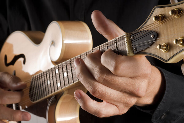 playing a classic mandolin