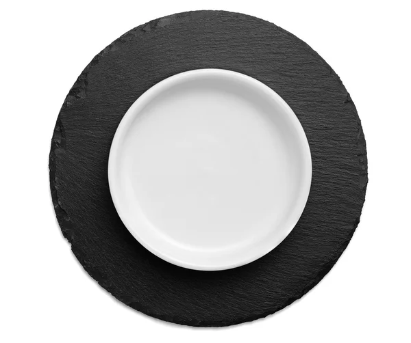 Biały danie na czarny Łupek okrągłe — Zdjęcie stockowe