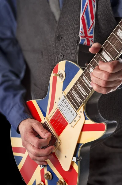 Playing british guitar — Stock Photo, Image