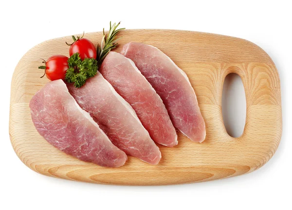 Filetes de cerdo crudos en la mesa — Foto de Stock