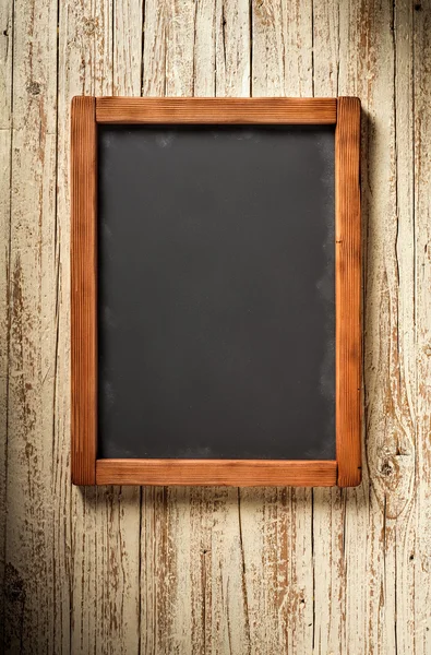 Vertical blackboard on wood — Stock Photo, Image