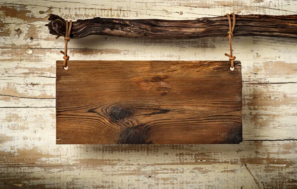 Rustic sognboard on aged wall — Stock Photo, Image