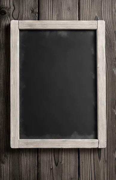 Vertical chalkboard on dark aged wood — Stock Photo, Image