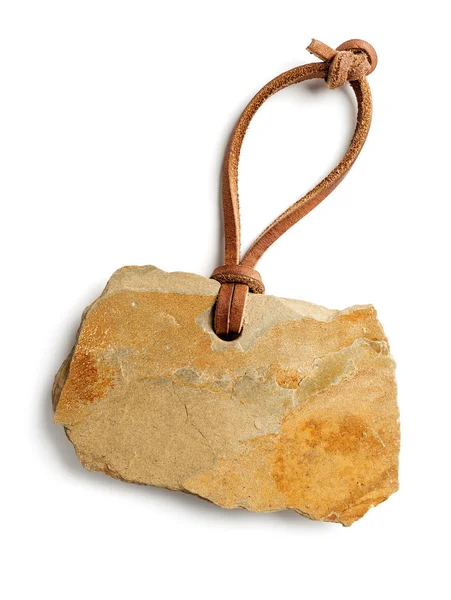 Beige stone tag with leather cord — Stock Photo, Image