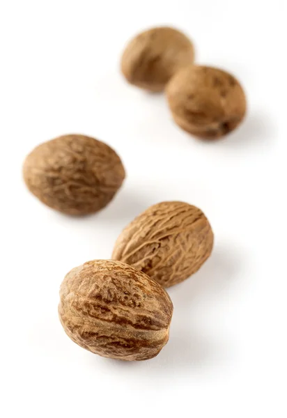 Nutmeg on white — Stock Photo, Image