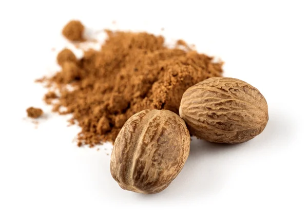 Nutmeg and ground nutmeg — Stock Photo, Image