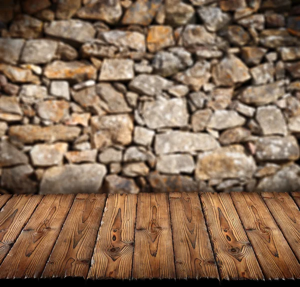 Suelo de madera con pared de piedra —  Fotos de Stock