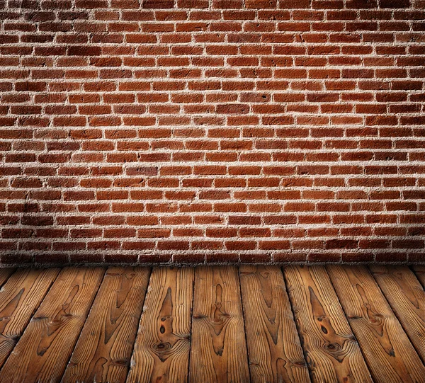 Bakstenen muur met houten vloer — Stockfoto