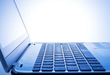 laptop keyboard on blue light clipart