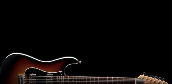 Electric guitar shape on black — Stock Photo, Image