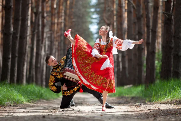 Couple of dancers in russian traditional costumes — Stock Photo, Image