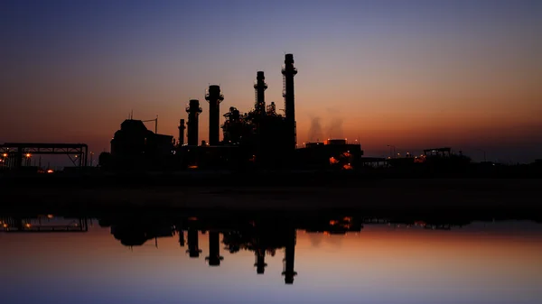 Gas turbine electrical power plant at dusk with light