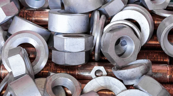 Nuts , bolts and copper bar — Stock Photo, Image