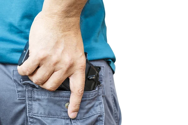 Pistola negra en bolsillo trasero — Foto de Stock