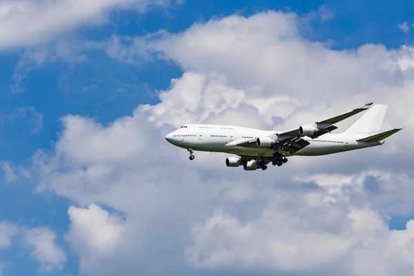 Plane on the blue sky background — Stock Photo, Image