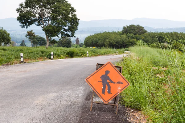 Under construction sign on damage road — Stock Photo, Image