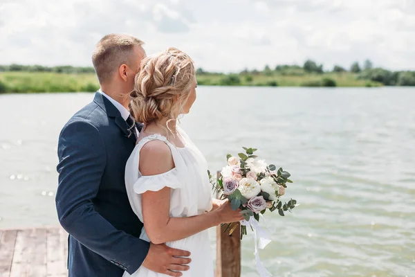 Groom Hugs Bride Tender While Enjoy Wind Lake — Stock Photo, Image