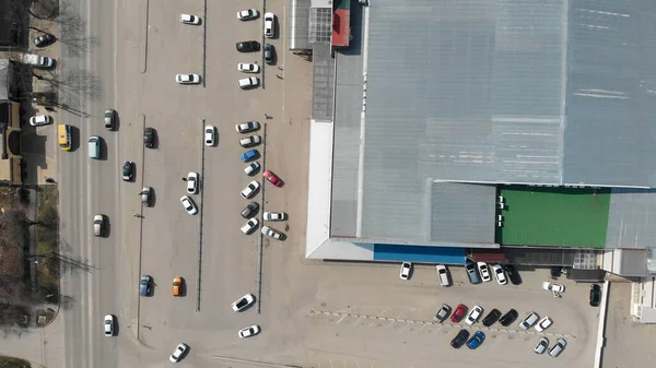 Aerial top view of the shopping center with cars and people. Hyper lapse (hyperlapse - time lapse)