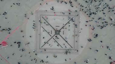 Aerial top down 4k view of people walking in the square.