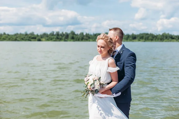 Groom Hugs Bride Tender While Enjoy Wind Lake — Stock Photo, Image