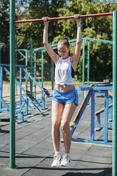 Young Woman Athlete Pulled Bar Gym Outdoors Stock Image
