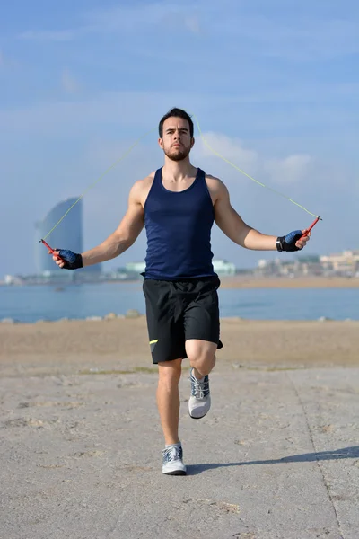 Athlete jumping rope in the city — Stock Photo, Image