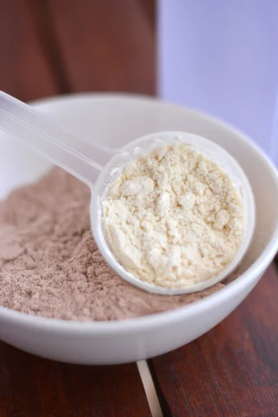 Syrovátkové bílkoviny chuť vanilky a čokolády — Stock fotografie