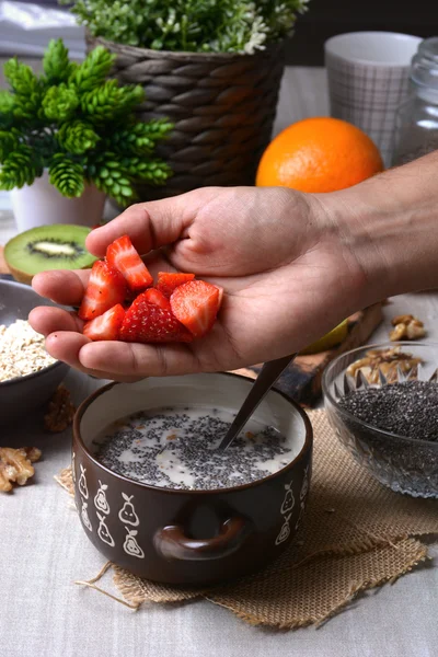 Preparation of breakfast with flakes of oats — Stock Photo, Image