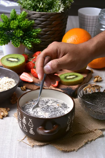 Preparation of breakfast with flakes of oats — Stock Photo, Image