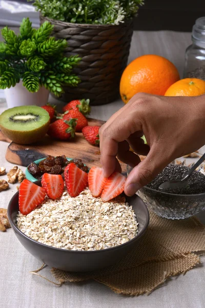 Preparation of breakfast with flakes of oats — Stock Photo, Image