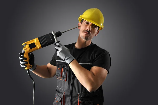 Trabalhador com capacete amarelo — Fotografia de Stock