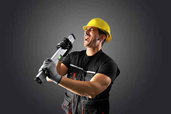 Trabalhador com capacete amarelo — Fotografia de Stock