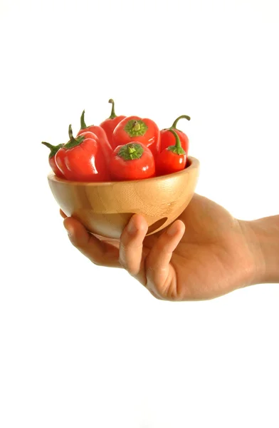 Hand holding red peppers — Stock Photo, Image