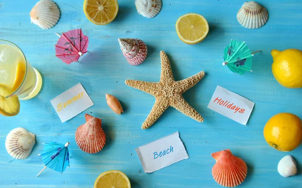 Starfish and seashells on blue wood — Stock Photo, Image