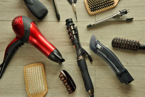 Hairdressing tools on a wooden floor — Stock Photo, Image