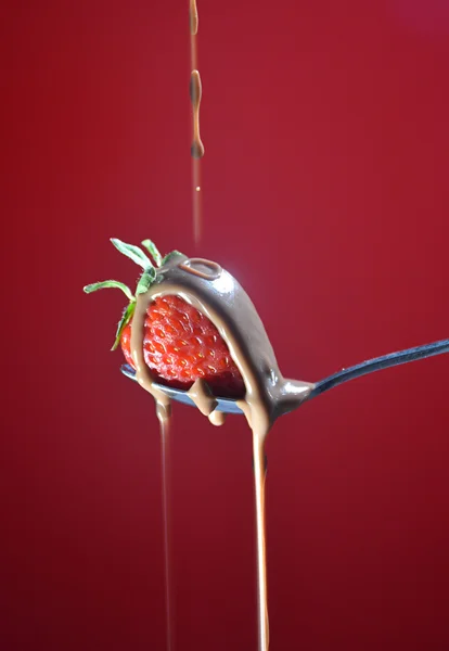 Strawberry falling a little chocolate liquid — Stock Photo, Image