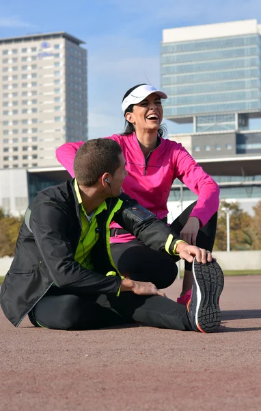Couple practicing running in the city — Stock Photo, Image