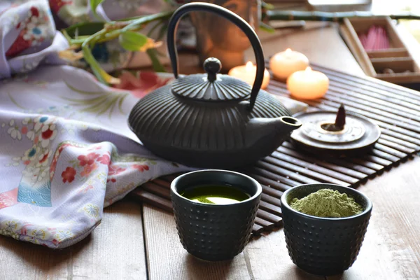 Cups filled with Japanese tea Royalty Free Stock Images