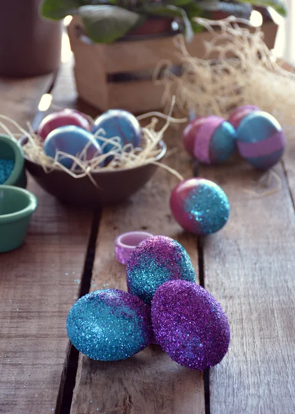 Easter egg painted with bright colors and glitter. — Stock Photo, Image