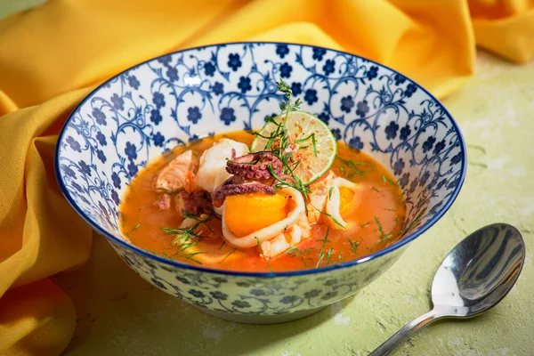 French Bouillabaisse fish soup with seafood, salmon fillet, shrimp, rich taste, tasty dinner — Stock Image French Bouillabaisse fish soup with seafood, salmon fillet, shrimp, rich taste, tasty dinner Royalty Free Stock Photos
