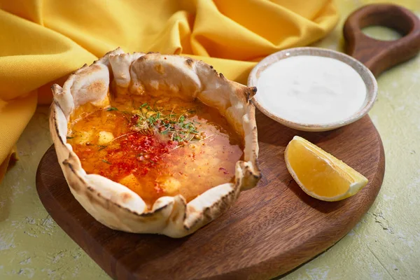 Red lentil soup with lemon, close-up on the table. horizontal view from above. Breakfast food concept, menu — Stock Image Red lentil soup with lemon, close-up on the table. horizontal view from above. Breakfast food concept, menu Royalty Free Stock Images
